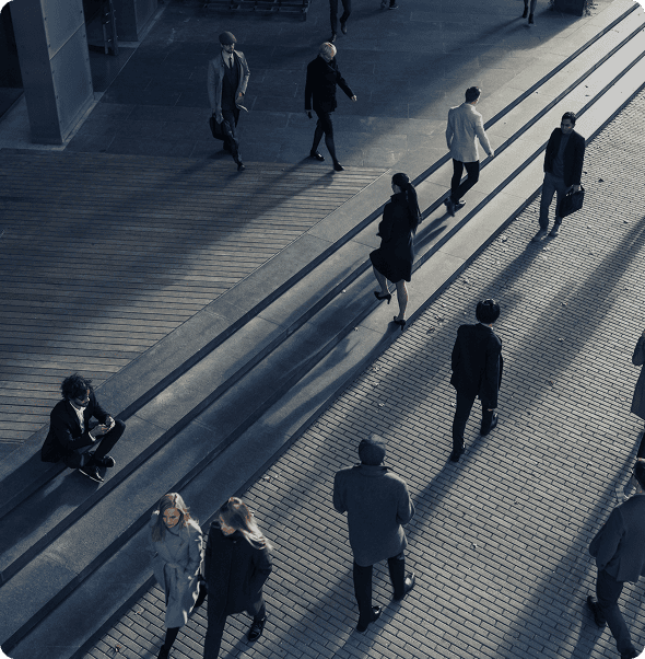 Modern business professionals walking outdoors in an urban setting, emphasizing connectivity and tea.