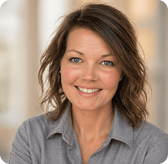 Modern woman smiling, representing professional success and confidence.