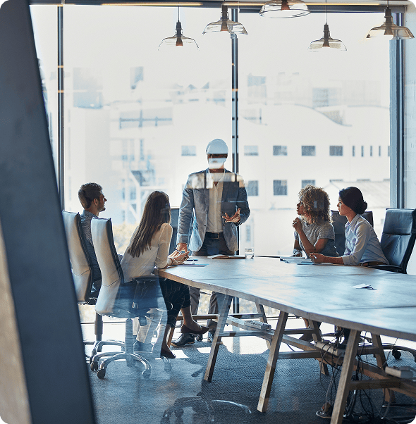 Virtual reality meeting with colleagues in a modern office conference room.