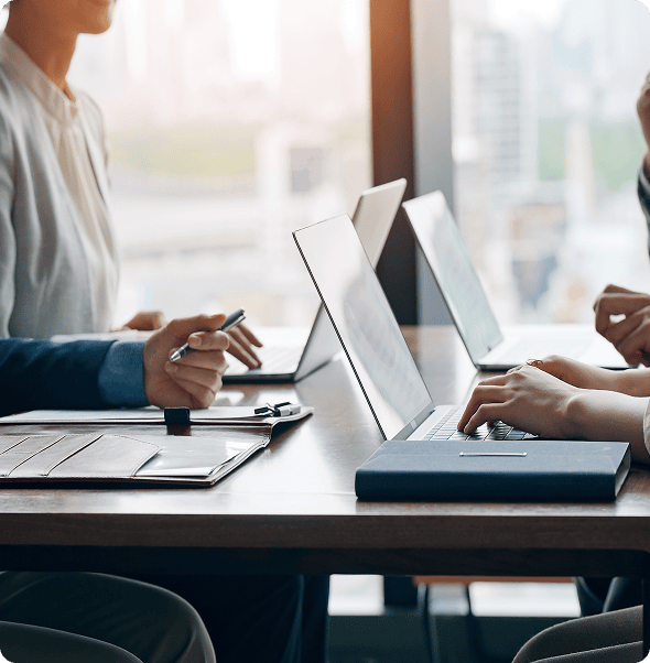 Efficient team collaboration using laptops in a modern office environment.